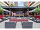 Upscale community outdoor area with lounge seating, a fire pit, and a bar at 1208 E Kennedy Blvd # 1019, Tampa, FL 33602