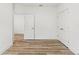 Bright bedroom with wood-look floors, white doors and walls at 13065 Tinamou Ave, Weeki Wachee, FL 34614
