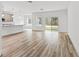 Open concept living room with sliding glass doors and breakfast bar at 13065 Tinamou Ave, Weeki Wachee, FL 34614