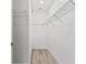 Walk-in closet with built-in shelving at 13065 Tinamou Ave, Weeki Wachee, FL 34614