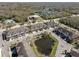 Aerial view of neighborhood featuring townhomes, pond, community center, and park at 1308 Syrah Dr, Oldsmar, FL 34677