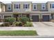 Charming townhome with manicured landscaping, attached garages, and inviting curb appeal at 1308 Syrah Dr, Oldsmar, FL 34677