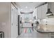 Modern kitchen features white cabinets, granite countertops, stainless steel appliances, and subway tile backsplash at 1308 Syrah Dr, Oldsmar, FL 34677