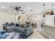 Open-concept living area features a dining nook, view to the kitchen, and comfortable seating at 1308 Syrah Dr, Oldsmar, FL 34677