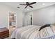 The main bedroom features a ceiling fan, closet, ensuite bathroom and carpet flooring at 1308 Syrah Dr, Oldsmar, FL 34677