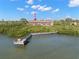 Waterfront condo featuring a private dock on serene waters surrounded by lush greenery at 14584 El Paseo Dr, Seminole, FL 33776