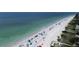 Breathtaking aerial view of sandy beach and the shimmering ocean at 14584 El Paseo Dr, Seminole, FL 33776
