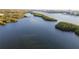 Expansive aerial view of waterways and lush islands, highlighting the natural beauty of the coastal landscape at 14584 El Paseo Dr, Seminole, FL 33776