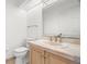 Bathroom featuring single sink vanity, toilet and medicine cabinet at 14584 El Paseo Dr, Seminole, FL 33776