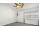 This bedroom features neutral carpet and a bright window at 14584 El Paseo Dr, Seminole, FL 33776