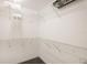 Walk-in closet with ample storage space, featuring white wire shelving at 14584 El Paseo Dr, Seminole, FL 33776