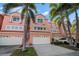 Charming townhouse featuring a two-car garage and well-maintained landscaping in a desirable neighborhood at 14584 El Paseo Dr, Seminole, FL 33776