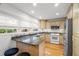 Bright kitchen with stainless steel appliances, granite countertops, and hardwood floors at 14584 El Paseo Dr, Seminole, FL 33776