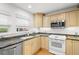 Bright kitchen featuring stainless steel appliances, granite counters and lots of cabinets at 14584 El Paseo Dr, Seminole, FL 33776