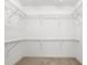 Large walk-in closet with multiple levels of wire shelving provides ample storage space at 14584 El Paseo Dr, Seminole, FL 33776
