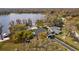 Aerial view showcases the home's proximity to the lake and private beach at 19242 Blount Rd, Lutz, FL 33558