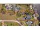 Expansive aerial view showcasing the property's generous lot, featuring a home, pool, and waterfront location at 19242 Blount Rd, Lutz, FL 33558