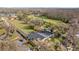 Scenic aerial view of a charming single-story home featuring a large yard at 19242 Blount Rd, Lutz, FL 33558