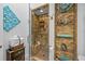 Stylish bathroom boasts a walk-in shower with a built-in bench, decorative shelving, and designer touches throughout at 19242 Blount Rd, Lutz, FL 33558