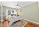 Cozy bedroom with a plush bed, decorative pillows, and an area rug for comfort at 19242 Blount Rd, Lutz, FL 33558