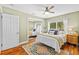 This inviting bedroom is a haven of comfort, featuring a mirrored closet and warm natural light through the window at 19242 Blount Rd, Lutz, FL 33558
