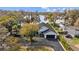 Lakefront property with a large front yard, driveway, and attractive curb appeal at 19242 Blount Rd, Lutz, FL 33558