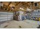 Spacious two car garage with high ceilings, work bench, and storage shelving at 19242 Blount Rd, Lutz, FL 33558