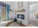 Modern living room featuring a fireplace with mantel, stylish decor, and view of bedroom at 19242 Blount Rd, Lutz, FL 33558