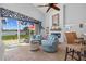 Bright living room with lake view, fireplace, and comfortable seating area at 19242 Blount Rd, Lutz, FL 33558