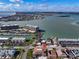Fantastic aerial view showcasing the property near the water, surrounded by coastal charm and nearby amenities at 227 126Th Ave, Treasure Island, FL 33706