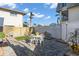 Beautiful fenced backyard featuring patio, table, fountain and well-maintained landscaping at 227 126Th Ave, Treasure Island, FL 33706