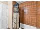 Bathroom with a tiled shower/tub combination and patterned shower curtain at 227 126Th Ave, Treasure Island, FL 33706