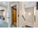 A residential elevator connecting two floors is accessible via a doorway on the left and stairs on the right at 227 126Th Ave, Treasure Island, FL 33706