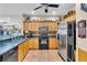 Well-equipped kitchen with stainless steel appliances, ample cabinet space, and tiled backsplash at 227 126Th Ave, Treasure Island, FL 33706