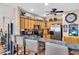 Open kitchen with stainless steel appliances, countertop seating, and modern finishes at 227 126Th Ave, Treasure Island, FL 33706