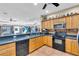 Kitchen with stainless steel appliances, countertop seating, and tiled backsplash at 227 126Th Ave, Treasure Island, FL 33706