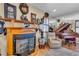 The living room showcases a cozy fireplace, piano, leather armchair, and ornate decor at 227 126Th Ave, Treasure Island, FL 33706