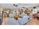 Spacious living room with plush seating, fireplace, and adjacent open kitchen area at 227 126Th Ave, Treasure Island, FL 33706
