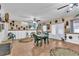 Spacious living room enhanced by tile flooring, ceiling fans, and direct access to outdoor spaces at 227 126Th Ave, Treasure Island, FL 33706