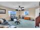 Spacious living room with expansive windows offering community views and comfortable seating at 227 126Th Ave, Treasure Island, FL 33706