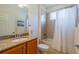 Bright bathroom featuring a vanity with granite counters, shower and tub combination at 2313 Nottingham Greens Dr # 2313, Sun City Center, FL 33573