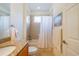 Bright bathroom featuring a vanity with granite counters, shower and tub combination at 2313 Nottingham Greens Dr # 2313, Sun City Center, FL 33573