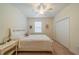 Bedroom featuring a ceiling fan, a window with blinds, and a closet at 2313 Nottingham Greens Dr # 2313, Sun City Center, FL 33573