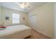 Bedroom featuring a ceiling fan, a window with blinds, and a closet at 2313 Nottingham Greens Dr # 2313, Sun City Center, FL 33573