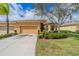 Charming home with a well-manicured lawn and beautiful landscaping, creating an inviting curb appeal at 2313 Nottingham Greens Dr # 2313, Sun City Center, FL 33573