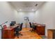 Office space with hardwood flooring, ceiling fan, multiple desks and chairs at 2313 Nottingham Greens Dr # 2313, Sun City Center, FL 33573