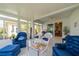 Bright sunroom with white tile flooring and comfortable seating, perfect for relaxation and enjoying the views at 2313 Nottingham Greens Dr # 2313, Sun City Center, FL 33573
