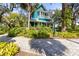 Beautiful home exterior with a porch and a brick pathway at 26 W Orange St, Tarpon Springs, FL 34689