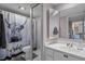 Functional bathroom with a shower-tub combo, modern vanity, and unique decorative touches at 2612 6Th Ct, Palm Harbor, FL 34684