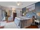Comfortable main bedroom featuring a ceiling fan, stylish furnishings, and sliding glass doors at 2612 6Th Ct, Palm Harbor, FL 34684